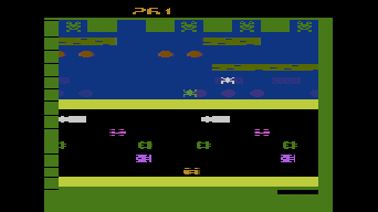 The player's frog is halfway home in Frogger.