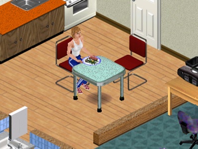 Cindy Samples sitting at her kitchen table, surrounded by several custom objects.