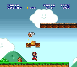 Mario hits a Goomba from below.