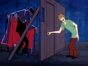Screenshot: What lurks behind this fake door? Shaggy's about to find out.
