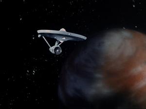 Image. The Enterprise in orbit of a planet.