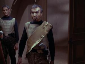 Image. Kor walking down a corridor (126-'Errand of Mercy')