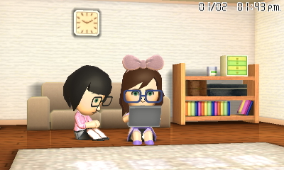 Tina and Gina playing computer games at Tina's place.