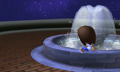 Polly aimlessly playing in the fountain.